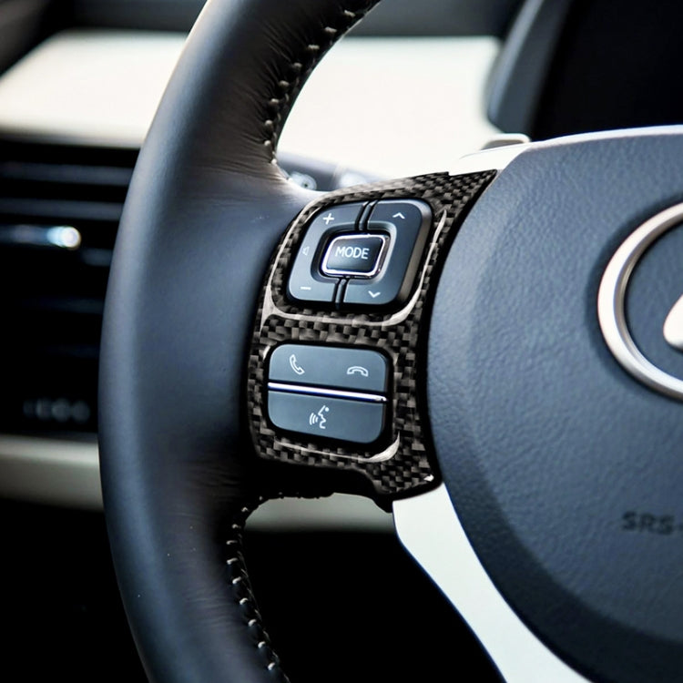 Carbon-fiber steering wheel button trim over control buttons on left side