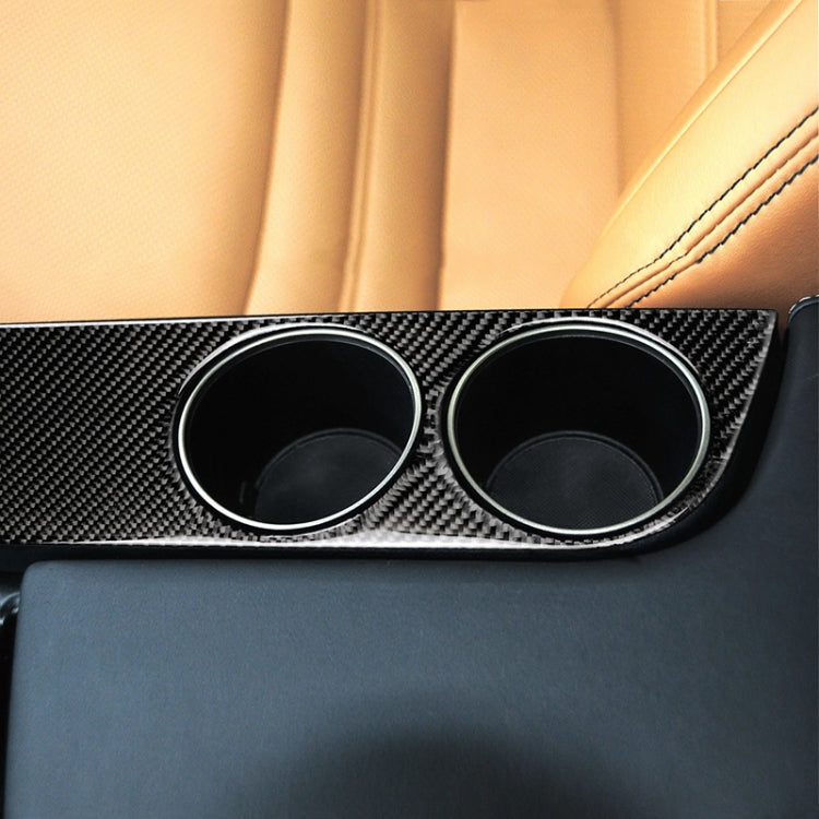 Carbon fiber cup holder trim sticker with two circular openings and silver edge