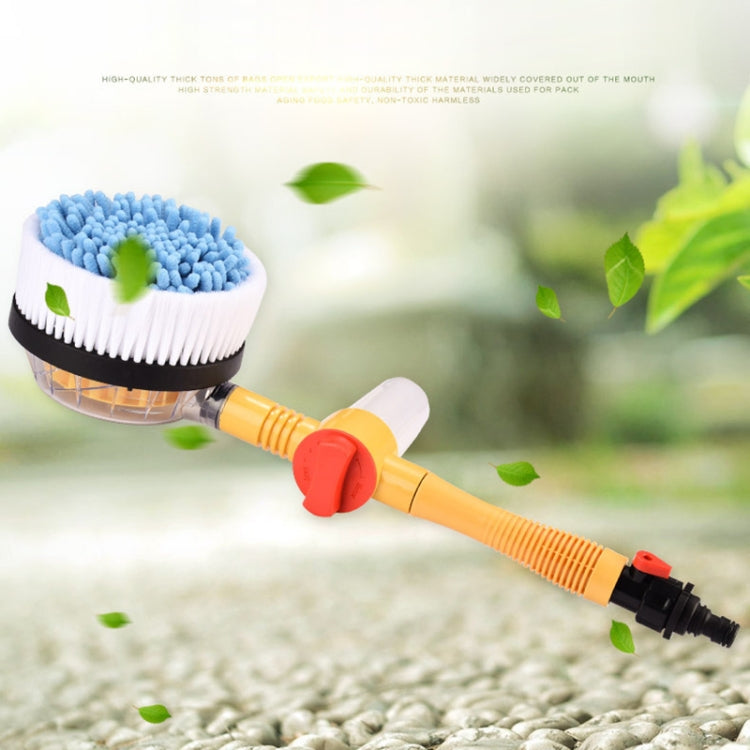 Orange and yellow car wash brush with blue chenille head and water spray