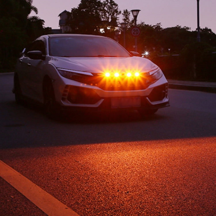 Amber front grille warning lights glowing on the vehicle