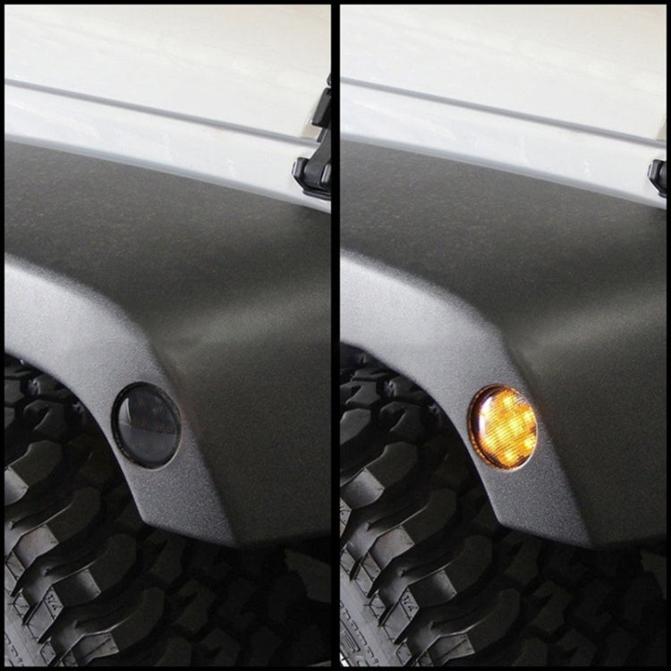 Vehicle fender with amber LED wheel eyebrow turn signal lights, lit and unlit