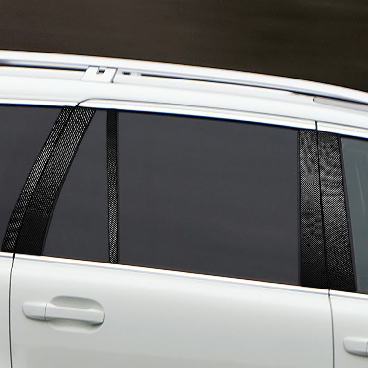 Installed carbon-fiber door pillar stickers with vertical stripe design on car window