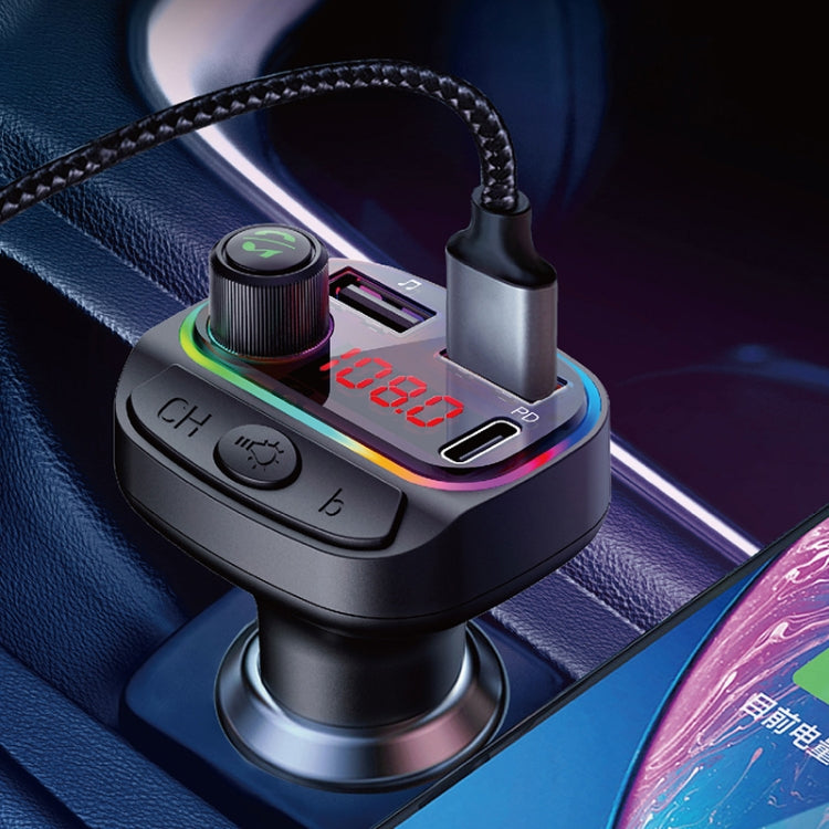 Car dual USB charger in dashboard with LED glow, dial buttons, and USB ports