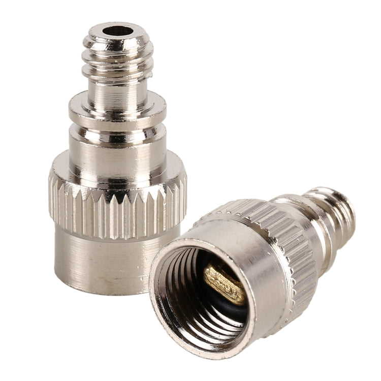 Silver inflator adapter with ribbed collar, threaded inlet, and angled outlet opening