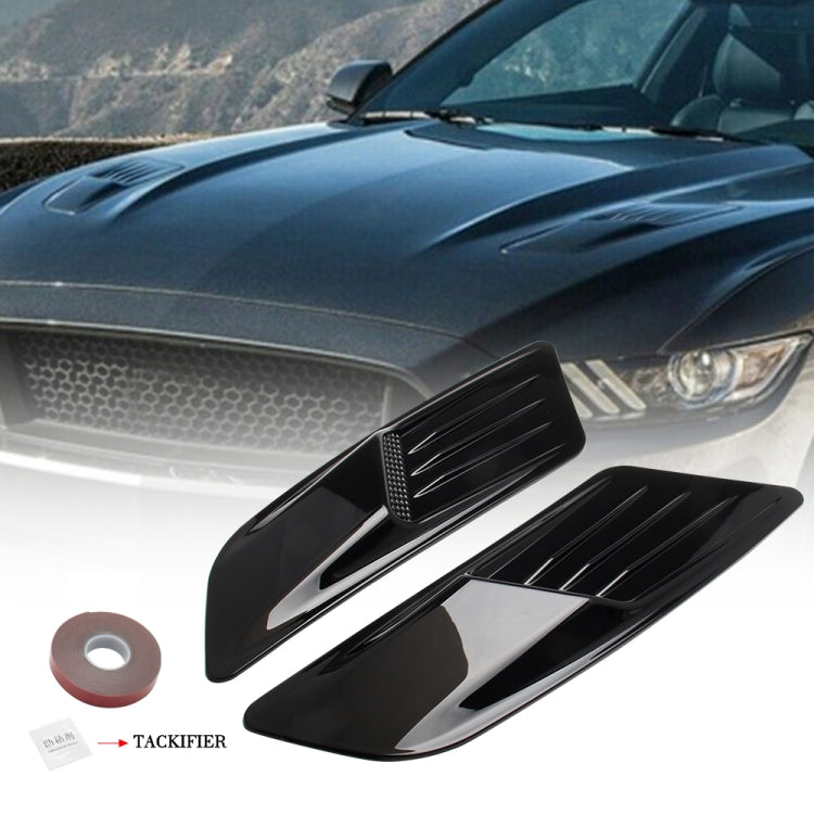 Bright black hood vent scoop set mounted on car fender, pair shown