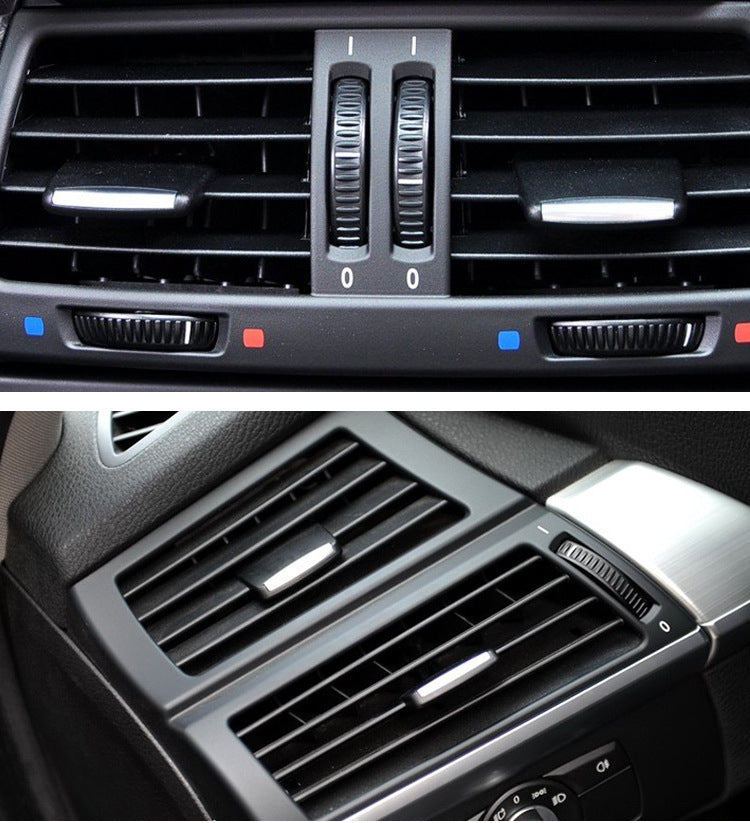 Dashboard air vent louver trim with two vertical sliders and silver vent bars