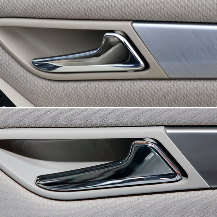 Chrome inner door handle installed on car door panel