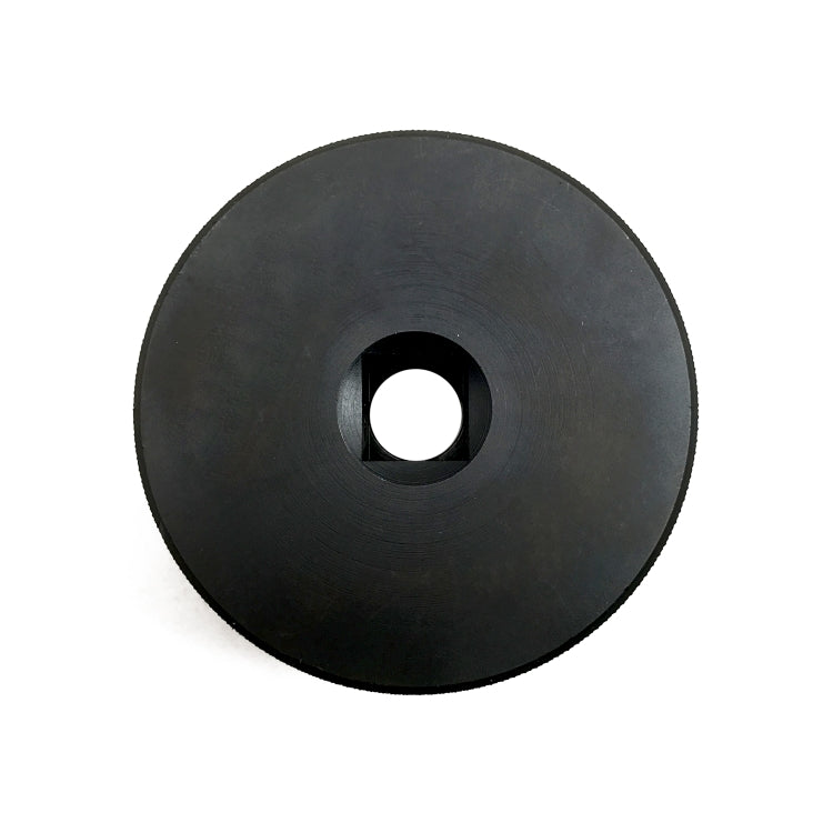 Black wheel nut socket adapter disc with central hole