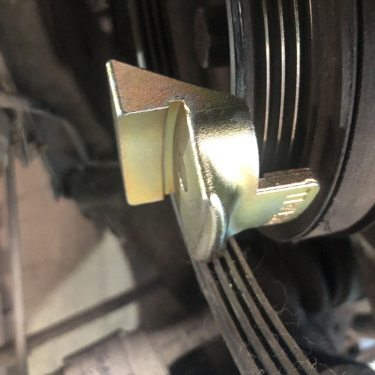 Car stretch belt remover/installer tool positioned on belt, gold bracket near pulley