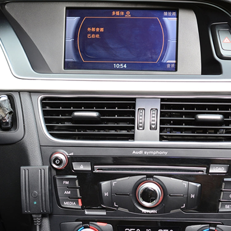 Car center console with Bluetooth audio wiring module plugged into dash area