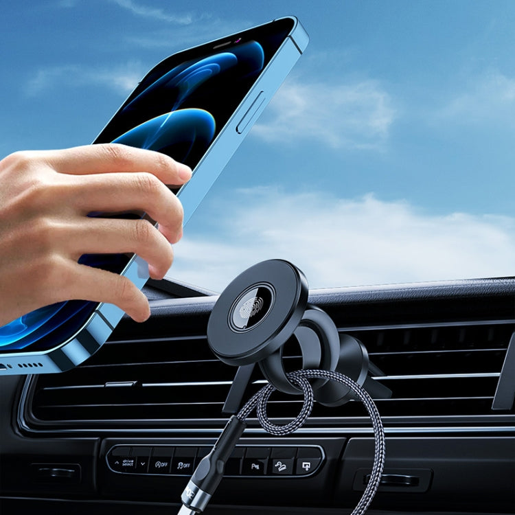 Magnetic phone mount attached to car air vent with a hand placing the phone