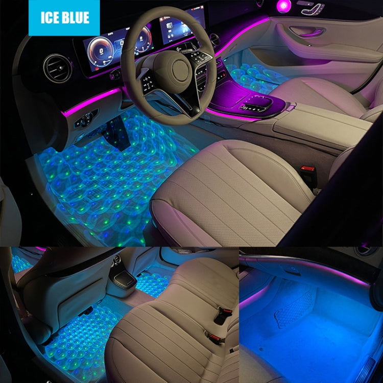 Blue RGB star-pattern foot LED lights illuminating car footwell and seats