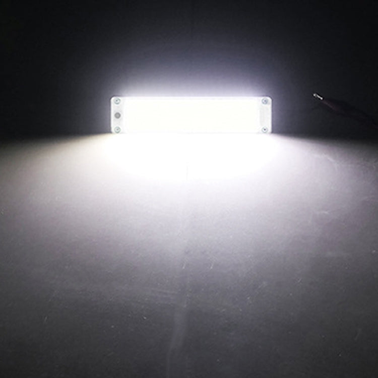 COB LED dome light bar shining bright white light from a clear rectangular module