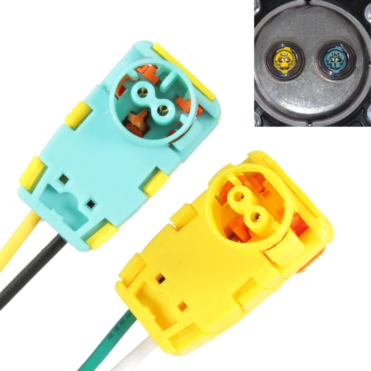 Car steering wheel airbag connector close-up with teal and yellow housings and exposed terminals
