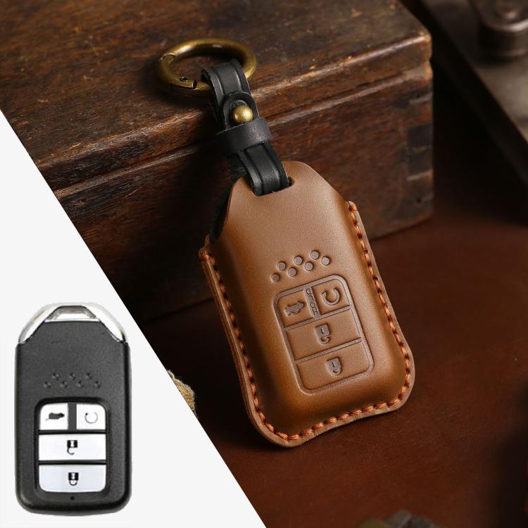 Brown cowhide leather key fob cover with key ring and embossed button icons, brown stitching