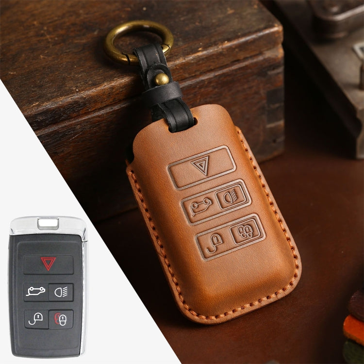 Brown leather key protective case with embossed button icons and stitched edges