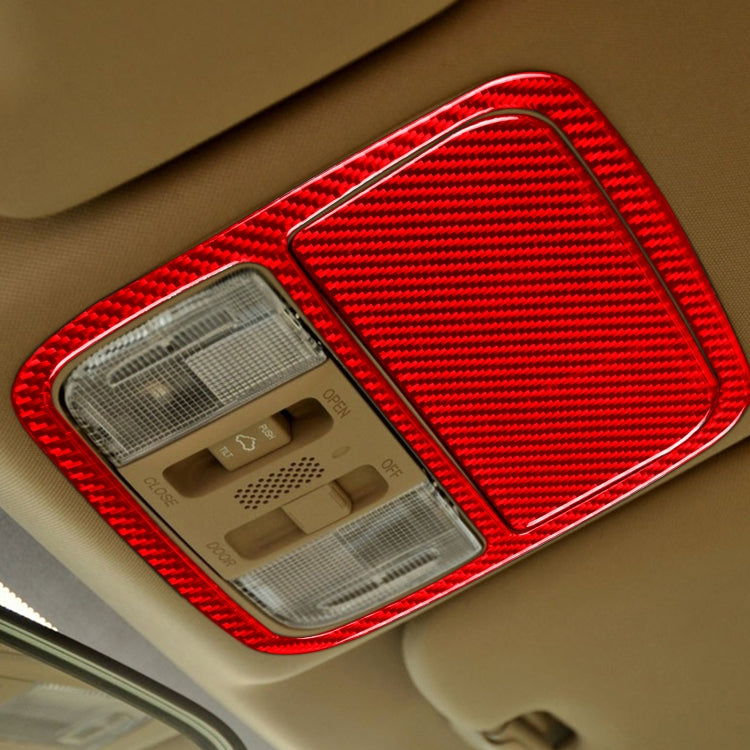 Installed red carbon fiber reading light panel covers two front dome light areas