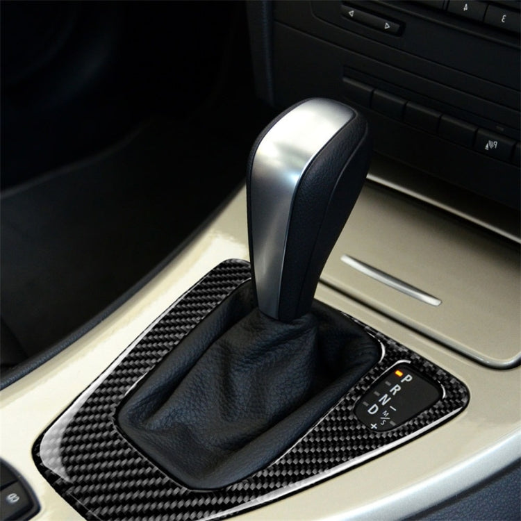 Carbon fiber right gear panel trim sticker with textured surround around shifter boot
