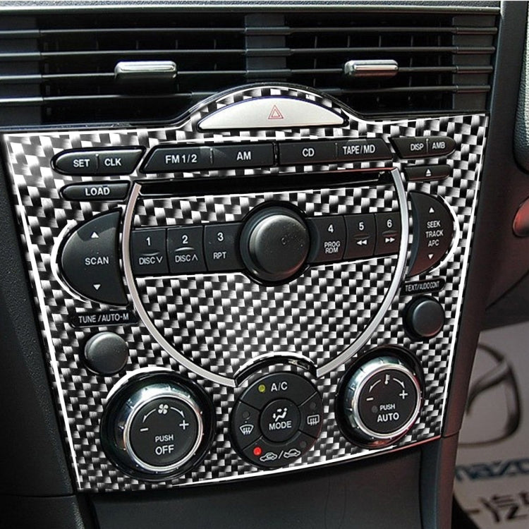 Installed carbon fiber dashboard multimedia panel sticker with radio and control buttons
