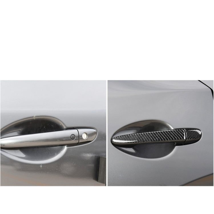 Carbon fiber exterior door handle trim sticker installed on car door handle, black