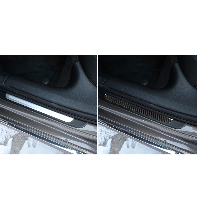 Car door sill threshold with black carbon fiber strip sticker on step area