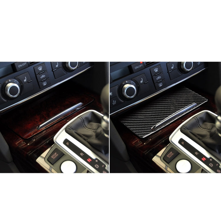 Carbon fiber look storage cover sticker installed on a car center console panel