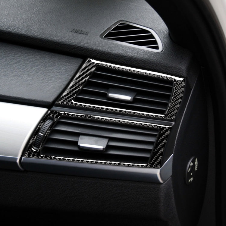 Carbon fiber-look side air outlet stickers installed on vehicle dashboard vent area