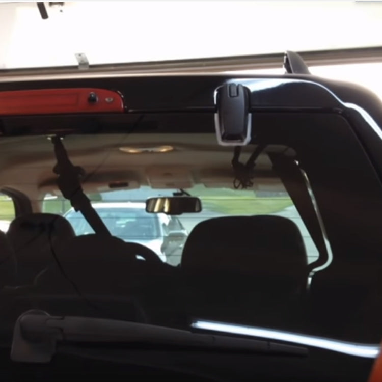 Installed black rear liftgate glass hinge bracket inside cargo area