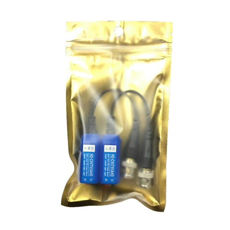 Video balun pair in gold protective bag with attached black coax cables