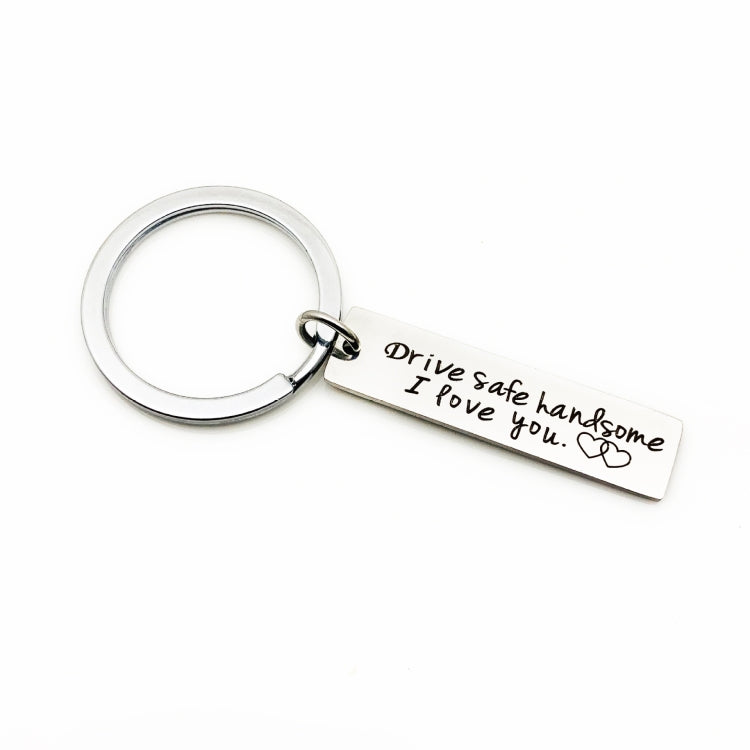 Stainless steel car-themed keychain with round ring and engraved “Drive safe…” bar