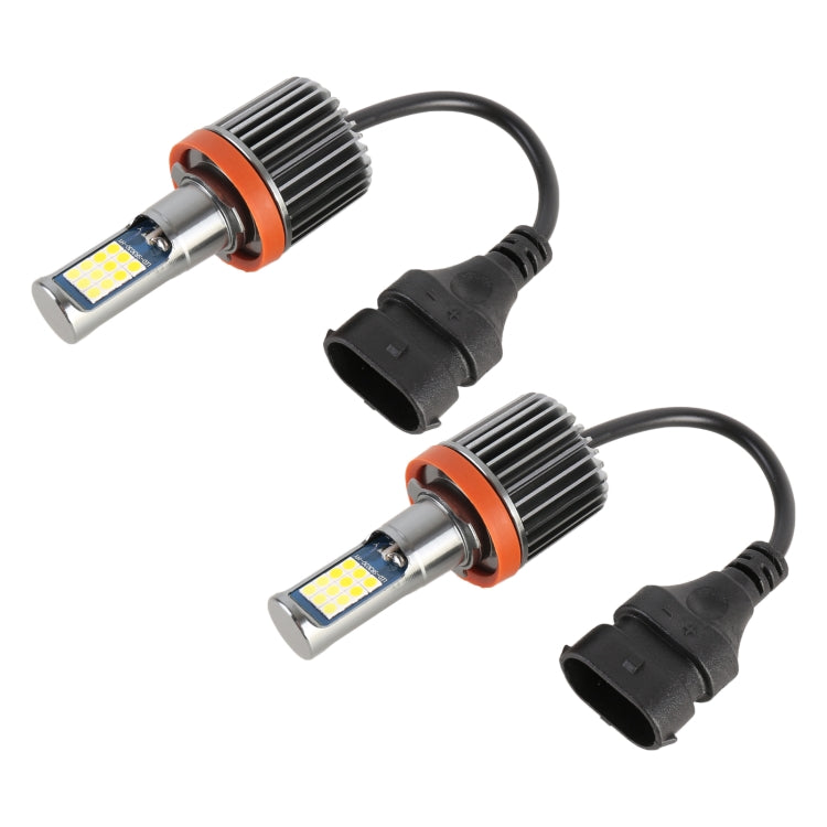 Two LED fog light bulbs with orange heat sinks and black socket wiring