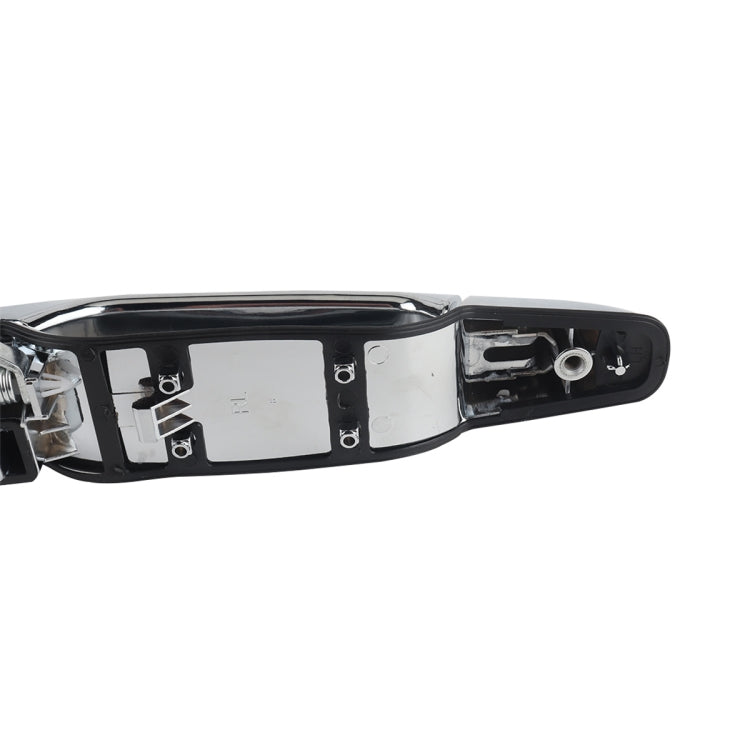 Left rear door outside handle close-up of black housing and mounting hardware