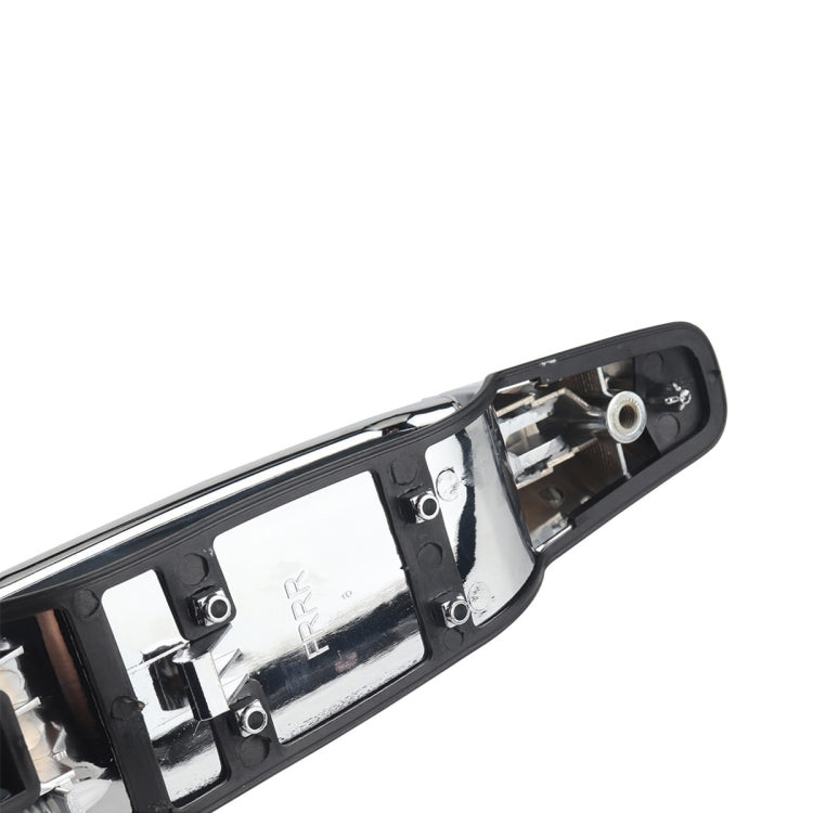 Inside view of outside door handle base with mounting holes and metal parts