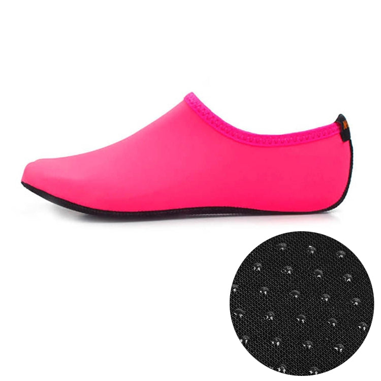 Pink non-slip diving water shoe with thick dark sole and textured grip dots