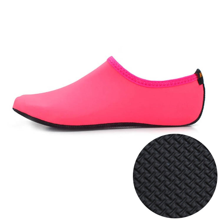 Pink neoprene dive shoes with textured non-slip rubber sole