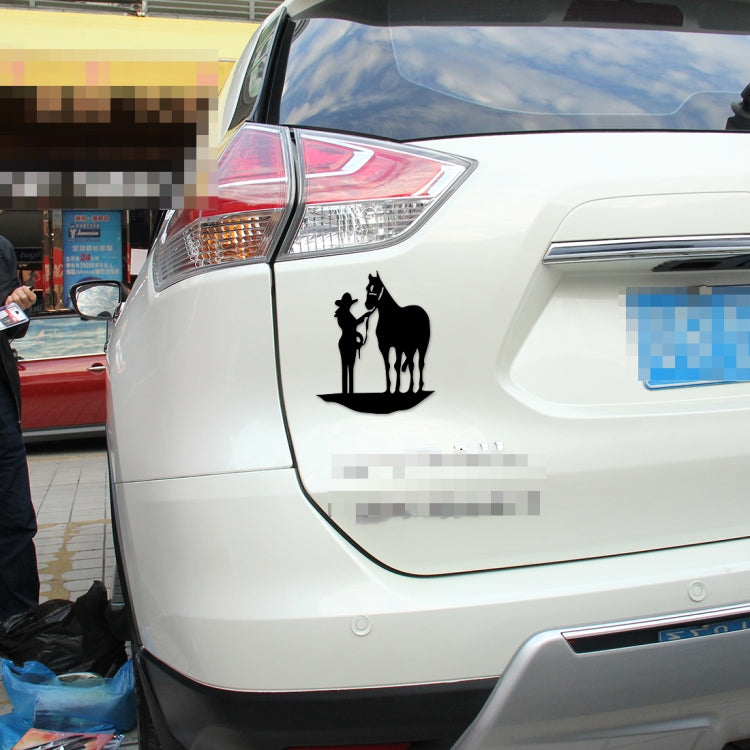 Black horse silhouette decal featuring rider and horse figures on car