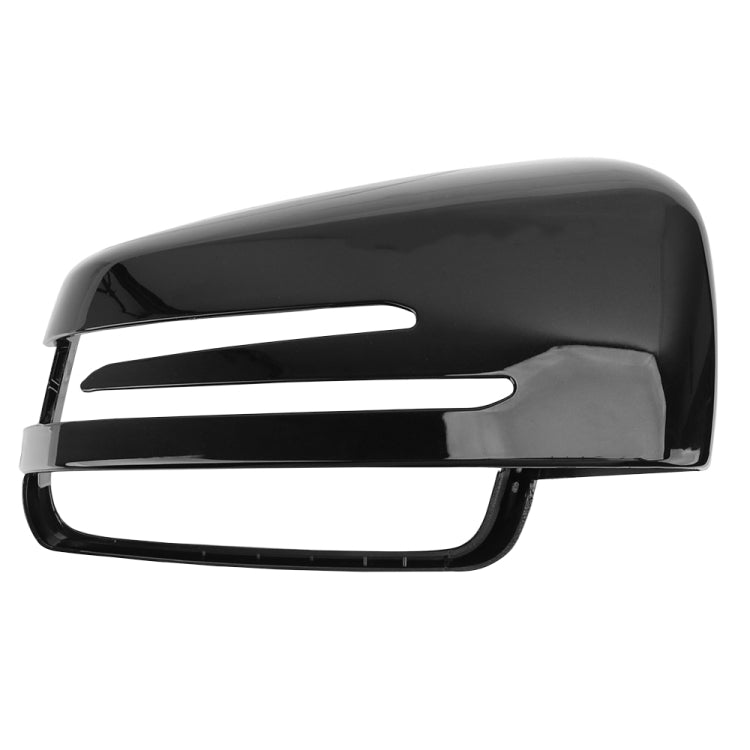 Black rearview mirror housing close-up with chrome accent strip and clear lens window