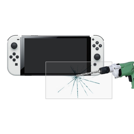 Tempered glass screen protector film with crack-protection graphic over handheld screen