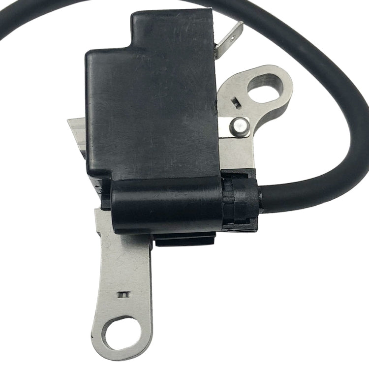 Ignition coil module close-up with black lead wire and metal bracket