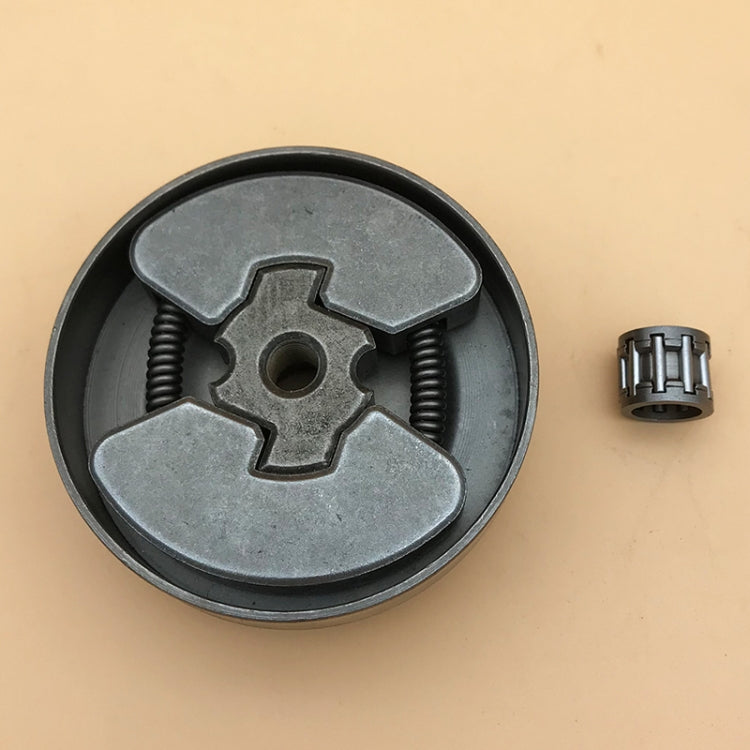 Chainsaw clutch passive disc, close-up of gray plates with springs and center mounting hole