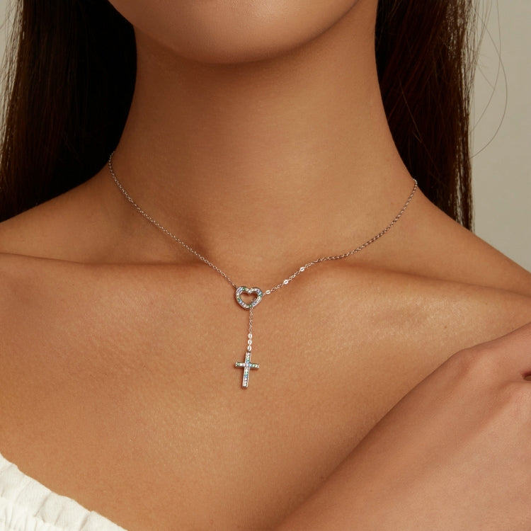 Sterling silver heart pendant and cross charm necklace with blue-green stone accents