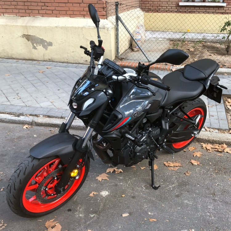 Motorcycle airflow deflector windshield installed on bike front, black curved wind shield