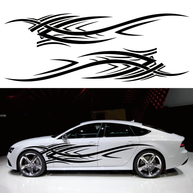 White sports car with black tribal totem graphic decals, side profile view