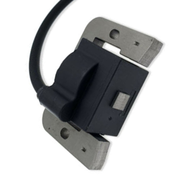 Black ignition coil module with metal mounting, attached to black electrical wire