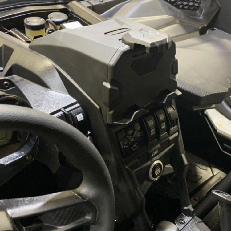 Black ATV device holder mounted on vehicle dash near steering
