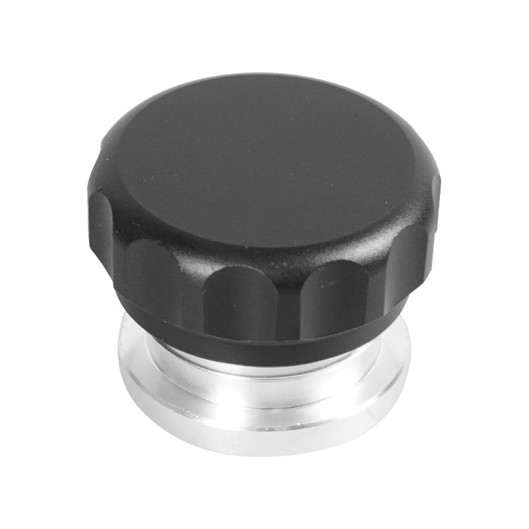 Domed black fuel tank cap with silver band and ribbed side sections