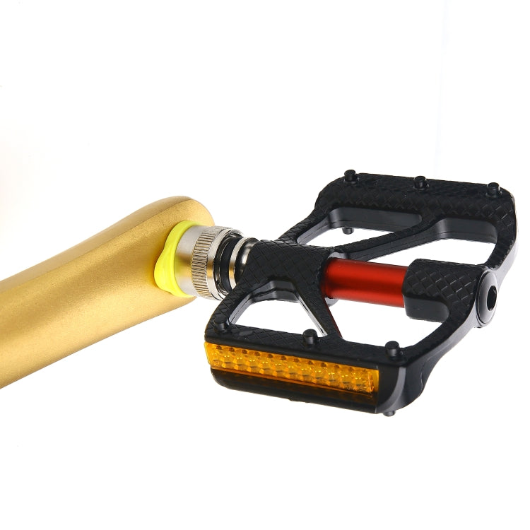Bicycle quick-release pedal with yellow mount side, red center, black carbon fiber body