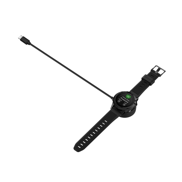 Watch charging dock on black sports smartwatch band with USB-C cable