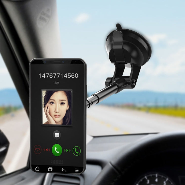 Windshield magnetic phone holder holding a smartphone in portrait orientation