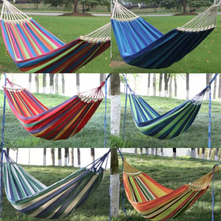 Multiple striped double canvas hammock swings with hanging ropes and fabric seats